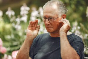 man with hearing loss wearing a hearing aid